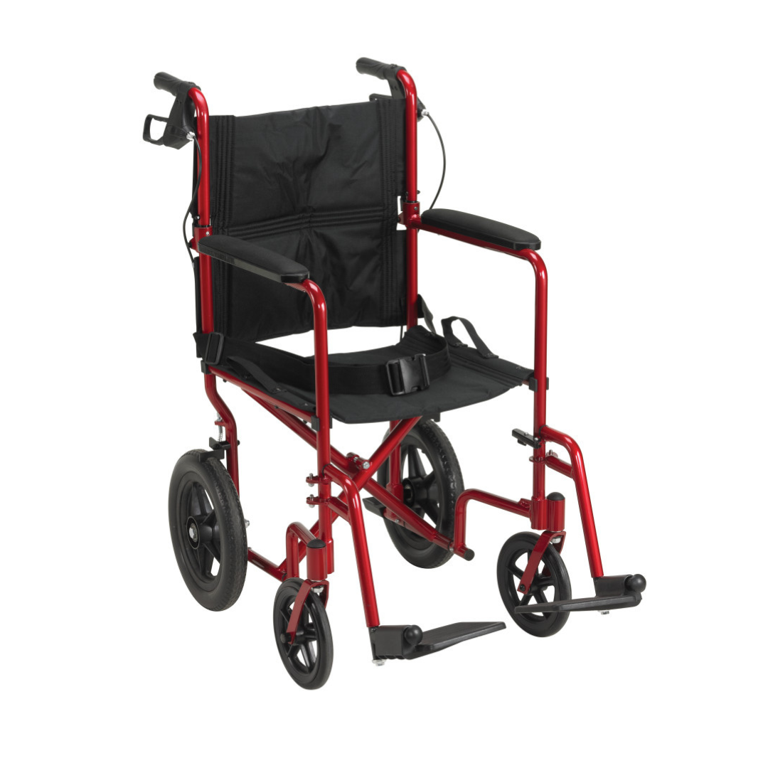 The Drive Lightweight Expedition Aluminum Transport Chair in red features a black seat and armrests, swing-away footrests, four wheels, and folds easily for improved caregiver mobility.